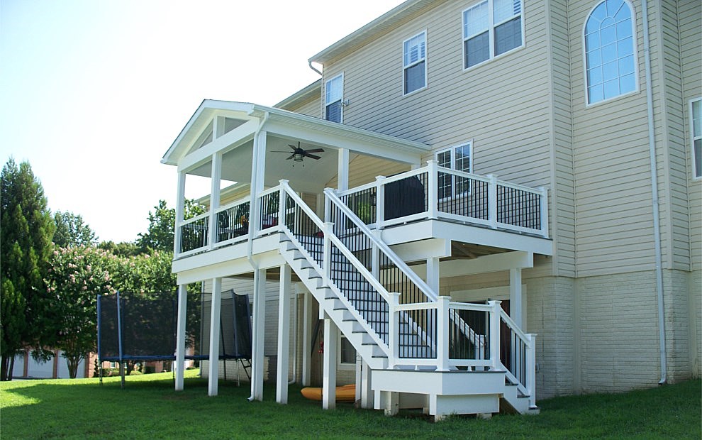 Beautiful covered deck with fascia warpping the deck and vinyl wrapped support beams and posts