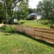 42 inch high cedar horizontal semi-privacy fence with alternating 1 x 4 and 1 x 6 spaced cedar boards and Dog Ear posts