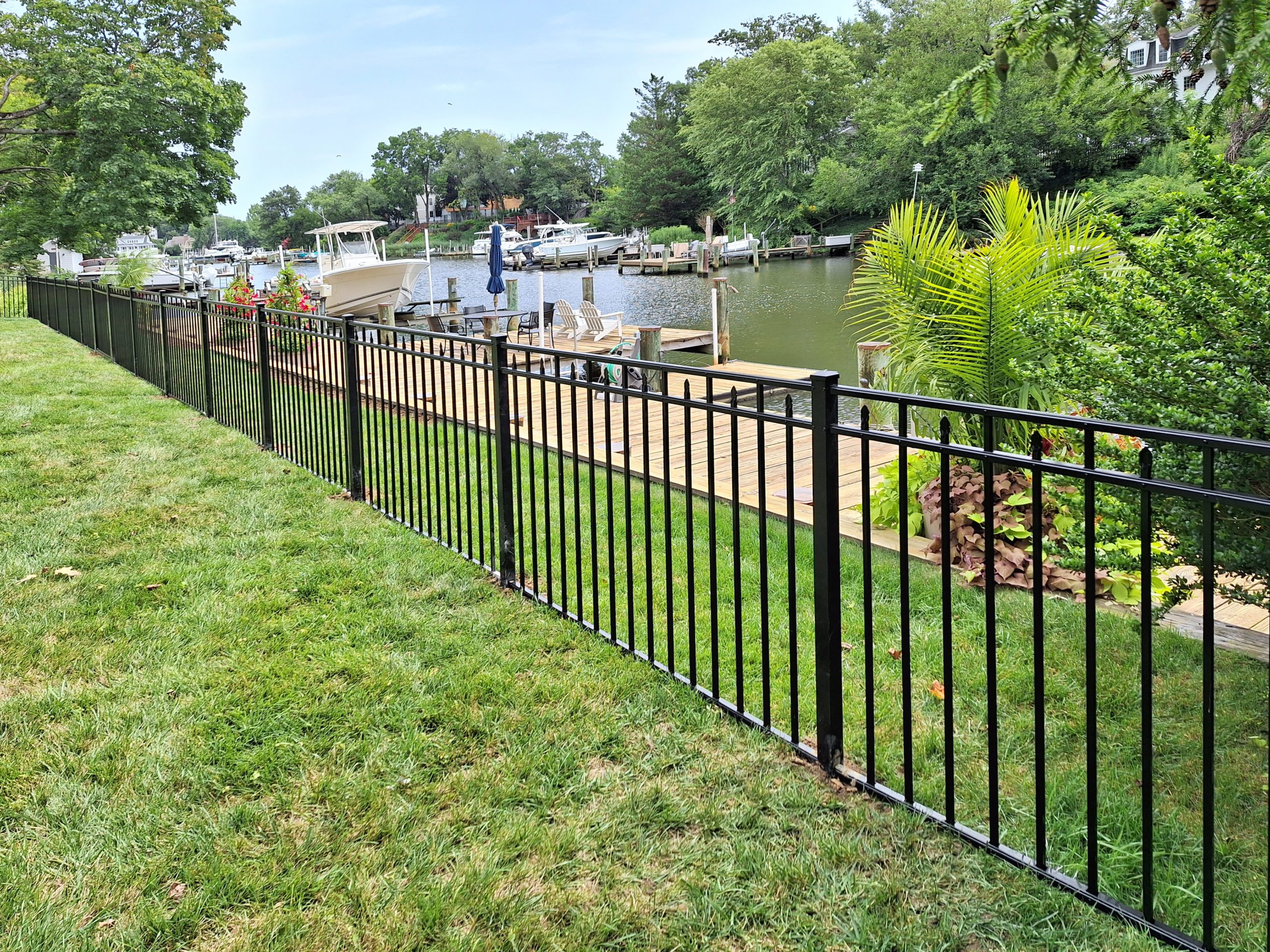 Black aluminum fence on waterfront property