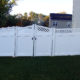 White Vinyl Privacy Fencing with Lattice top and double arched gate