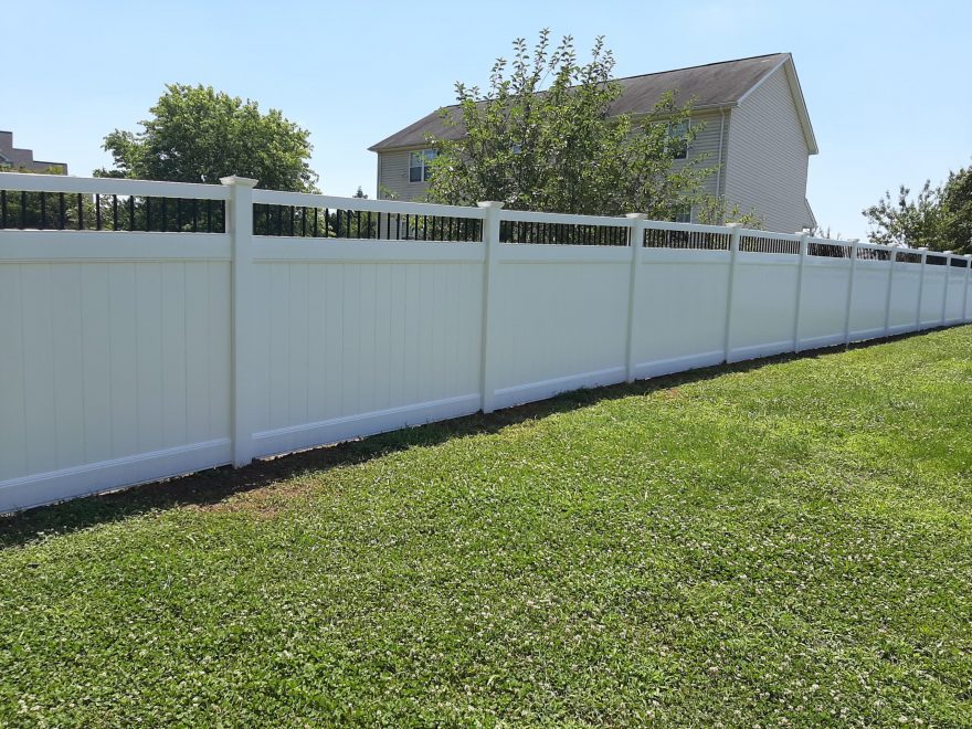 6 foot high white vinyl privacy fence with black aluminum spindle toppers