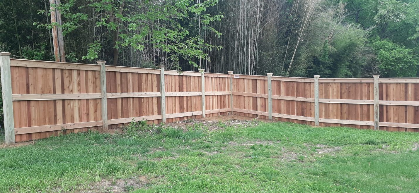 6_ high cedar board and batten privacy fencing with 6x6 post and cedar New England post caps Fence to have 1x6 cedar fascia board on top only