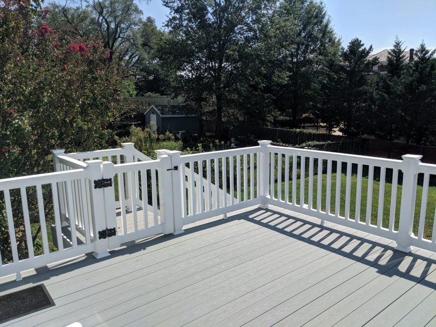 TimberTech Terrain Stone Ash Deck Boards with White Washington Vinyl Railing and gate at the top of the stairs in Hyattsville MD