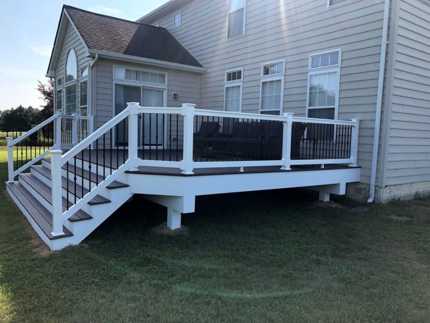 Trex Lava Rock Decking with White Washington Vinyl Railing with collars on Black Aluminum Balusters + Extra Wide Steps