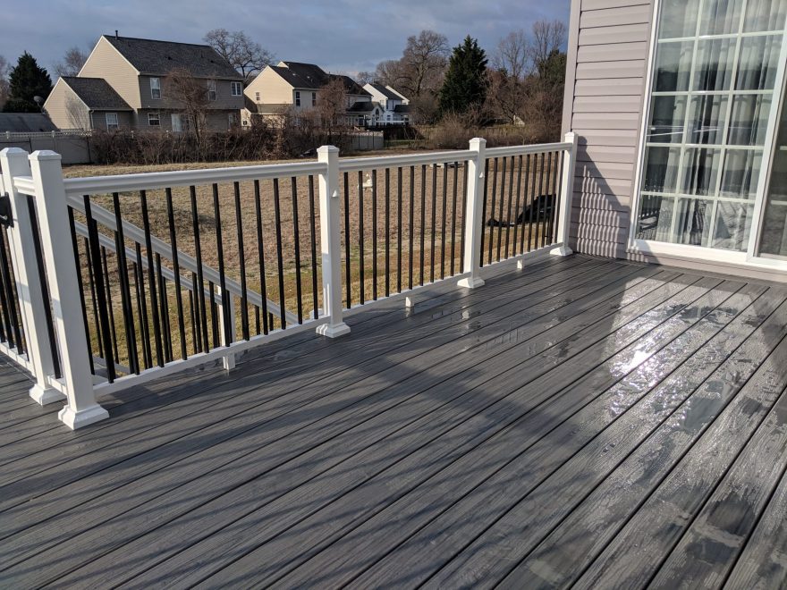 Trex Trancend Island Mist Decking with Tuxedo Mixed Color Utralox Aluminum Railing and Eyeball Lights on Posts