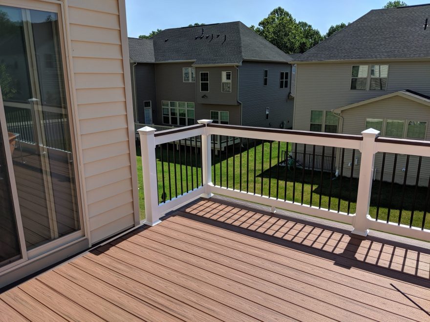 Trex Transcend Tiki Torch Deck Boards + Lava Rock Feature Board + White Lincoln Vinyl Railing with Black Aluminum Balusters + Matching Lava rock Cocktail Rail