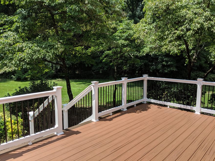 Trex Transcend Tiki Torch Deck Boards with White Washington Vinyl Railing and Black Aluminum Balusters in Gambrills MD