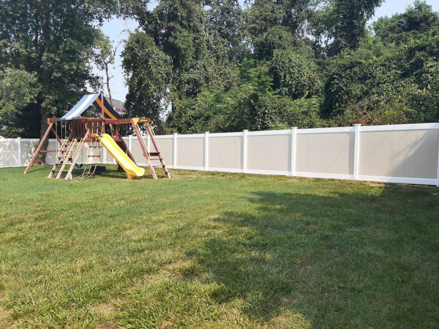 Two toned tan and white vinyl privacy fence 3