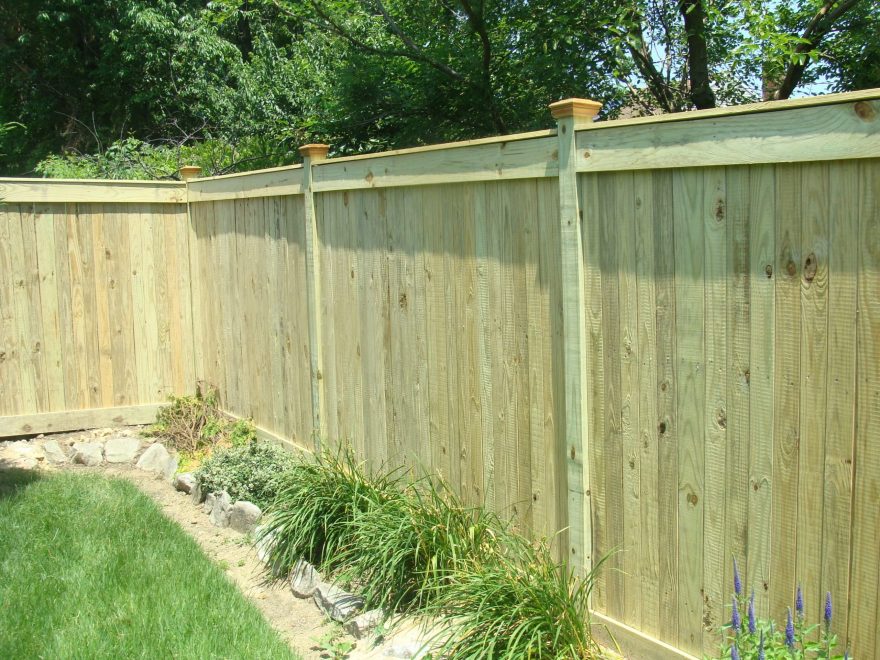 Vertical Board Wood Privacy Fence withNew England Caps and Fascia Board top and bottom