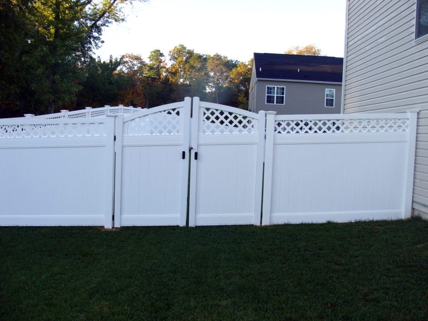 White Vinyl Privacy Fencing with Lattice top and double arched gate